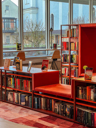 Bookshelves with various books in the city library.
