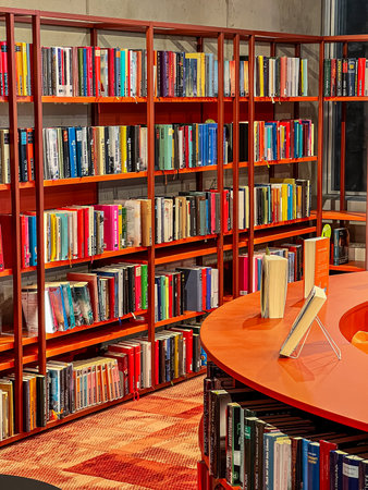Bookshelves with various books in the city library.の写真素材