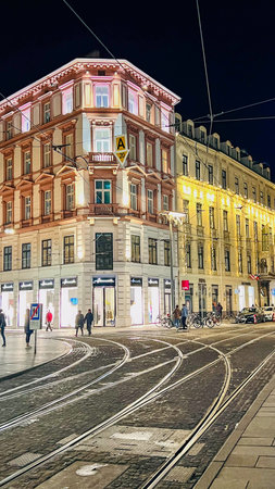 Graz. Styria, Austria - 16/03/2024: View of the evening roadway of the street.