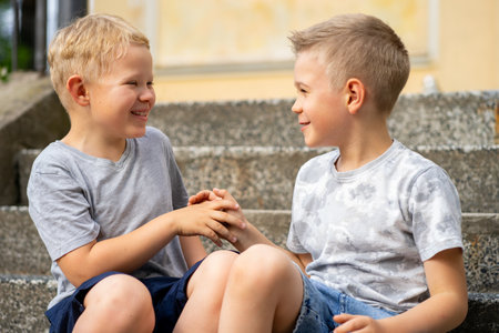 Two boys playing and having fun together.
