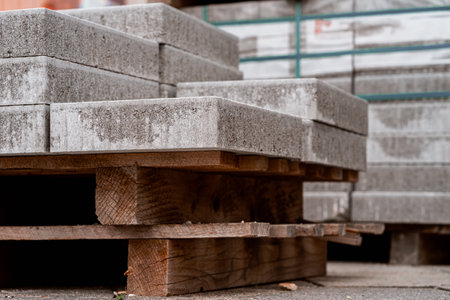 Stone slabs for road repairs stacked on a wooden pallet.の写真素材