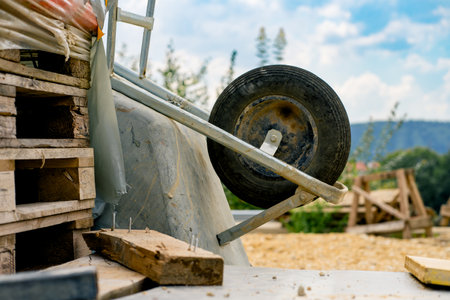 Various building materials and fixtures near a house under construction.の写真素材