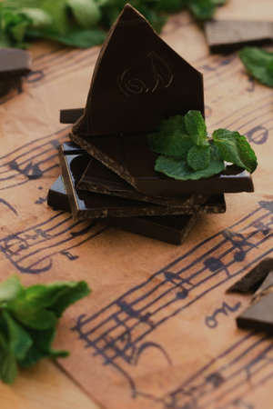 Sweet homemade chocolate with mint in vintage style and music paperの写真素材