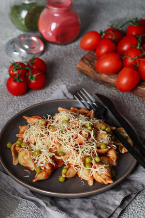Pasta with cherry tomatoes, peas and Parmesan cheese. Homemade Italian pasta with tomatoes and sauceの写真素材