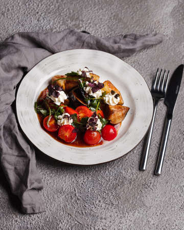 Restaurant menu. Warm salad with eggplant and beef