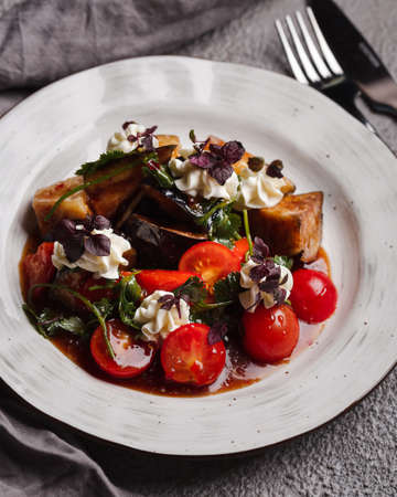 Restaurant menu. Warm salad with eggplant and beef