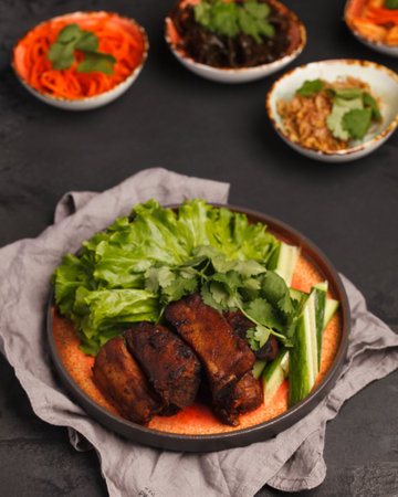 Asian cuisine. Ribs on the grill with vegetables. Traditional Chinese and Korean cuisineの写真素材