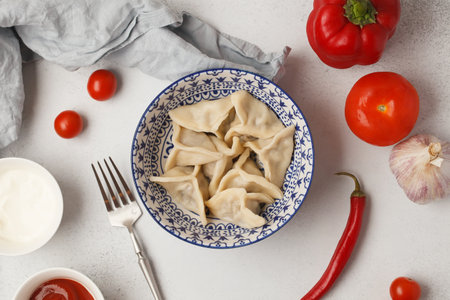 Prepared semi-finished products. Dumplings, khinkali, manti. New year's atmosphereの写真素材