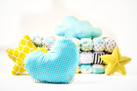 Pillows and patchwork comforter on white backgroundの写真素材