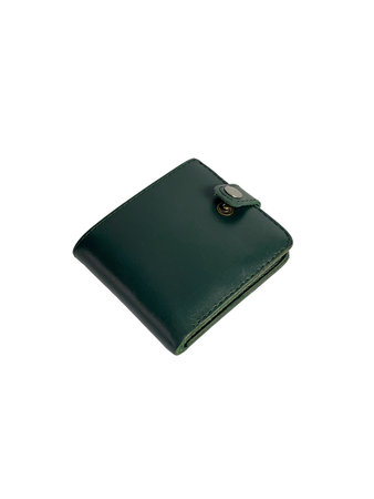 A dark green leather wallet, closed with a snap, is placed on a plain white background. The wallet's texture and form are clearly visible.の写真素材