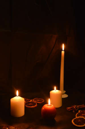 Group of burning candles on black background.の写真素材