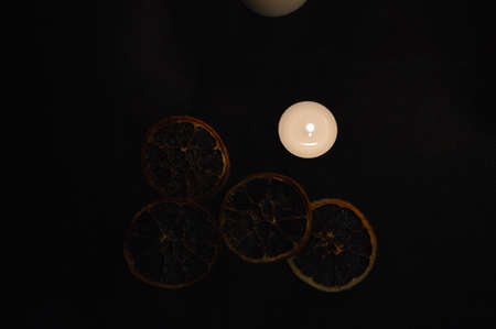 Group of burning candles on black background.の写真素材