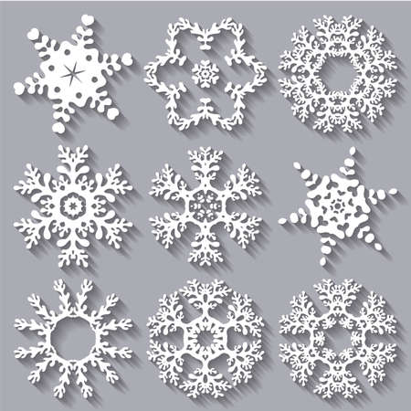 Snowflakes flat icon set collection. Set of nine carved varied snowflakes with long shadows.のイラスト素材