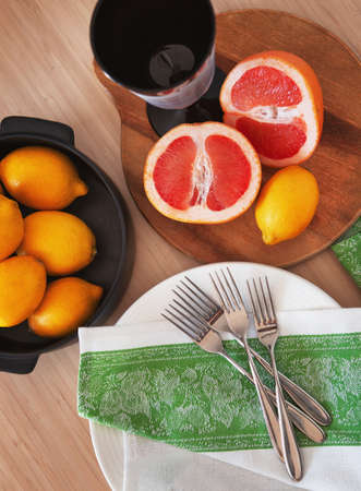 Colorful flat lay Fresh citrus fruits for lemonade on wooden board. Healthy drink, lemon and...