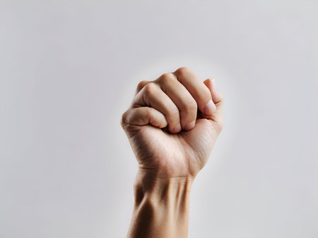 hand in a fist on an absolute white background, rights, strength, male and female strongの素材