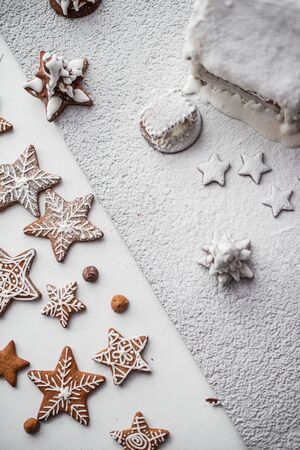 Grainy and unsharp background. gingerbread cookies in the form of stars and snowflakes on a white...