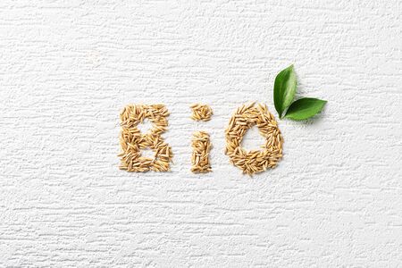 Word Bio laid out from oatmeal seeds on a white texture backgroundの写真素材