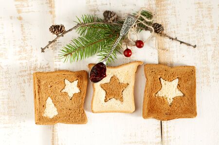 Christmas breakfast. Slice toast bread on wooden boards.の写真素材