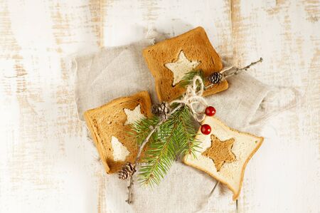 Christmas breakfast. Slice toast bread on wooden boards.の写真素材