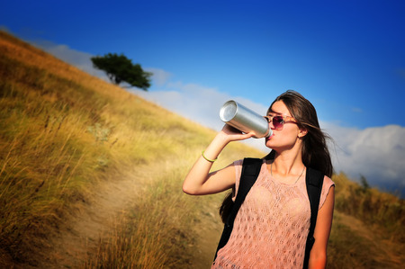 Woman tourist with water bottle outdoors.の写真素材
