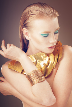 Fashion portrait of glamour Model girl with blue and golden Makeup.の写真素材