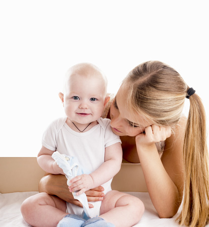 Mother with baby, isolated on white.の写真素材