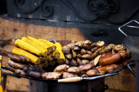 close-up  vegetables and meat cooked on the barbecue