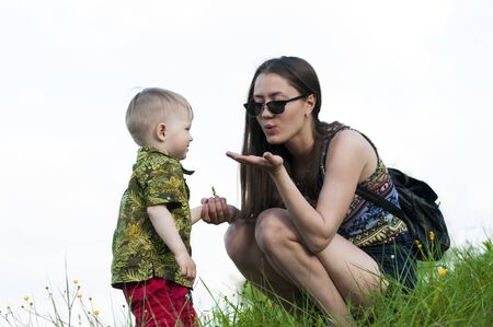 Mom spends time with her son in natureの写真素材