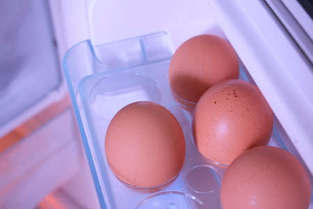 Eggs in refrigerator -Closeup of eggs in refrigeratorの写真素材