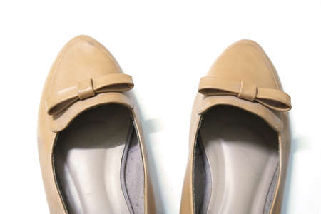 woman brown shoes isolated on white backgroundの写真素材