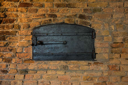 Typical Italian oven for bread and pizza. Nice fire light and colors. Horizontal photo with bricks texture.の写真素材