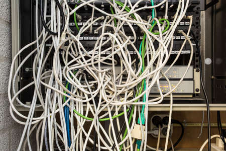 Chaos of network cables tangled computerの写真素材