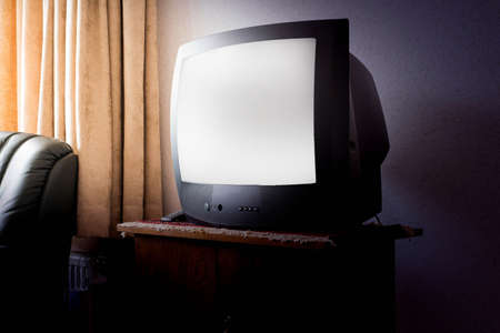 Vintage Television on wooden antique closet, old design with white screenの写真素材