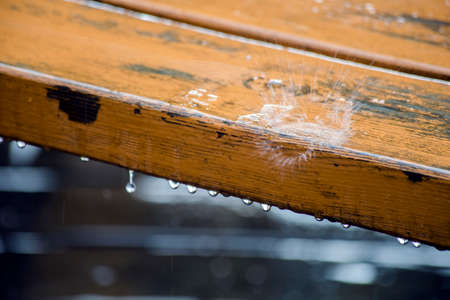 Drop of water on wood with raindropの写真素材