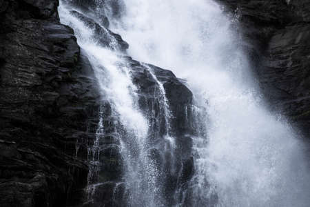 Dark Blue stream waterfall closeup background , beauty in nature rocks