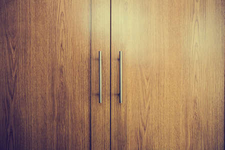 Close up of a closed wooden door brown design background texture vintage interior
