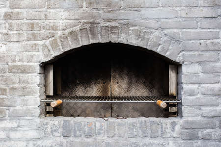 Traditional used stone oven close-up grey bricksの写真素材