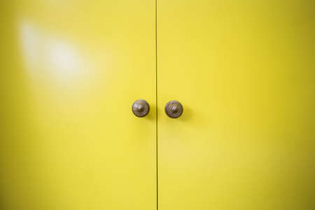 Modern clean new yellow wooden doors close-upの写真素材