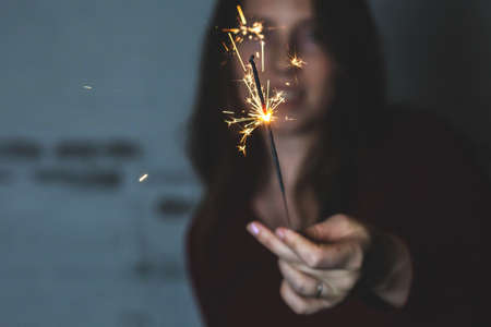 Woman with Sparkler fireworks Celebration Happiness Firework Conceptの写真素材