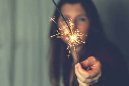 Woman with Sparkler fireworks Celebration Happiness Firework Conceptの写真素材