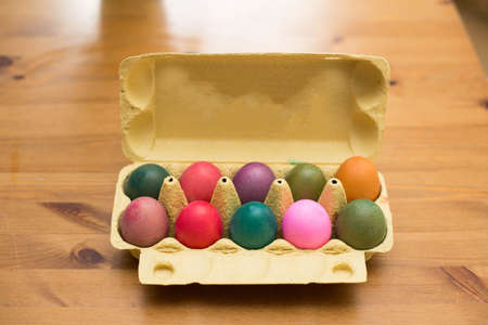Colorful Easter eggs in box on a table, easter decoration