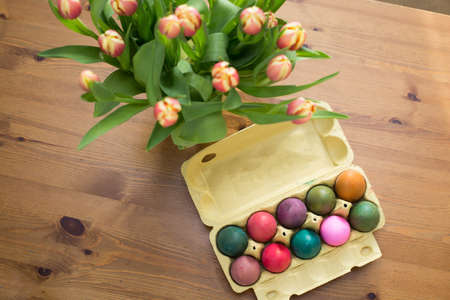 Colorful Easter eggs in box on a table, easter decorationの写真素材