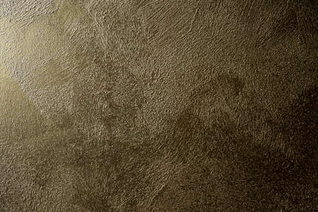 Grunge concrete wall texture gold brown shiny color retro designの写真素材