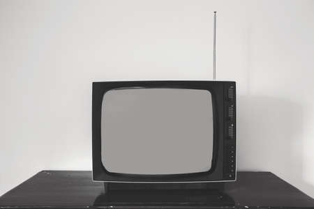 Retro old television receiver on the table front, vintage design black and whiteの写真素材
