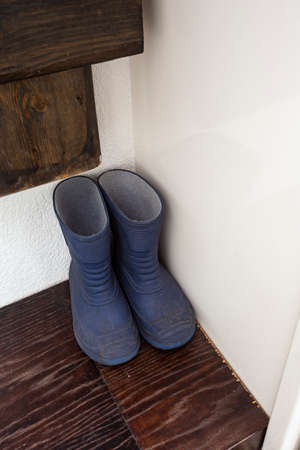 little blue rain boots in the closet, for children