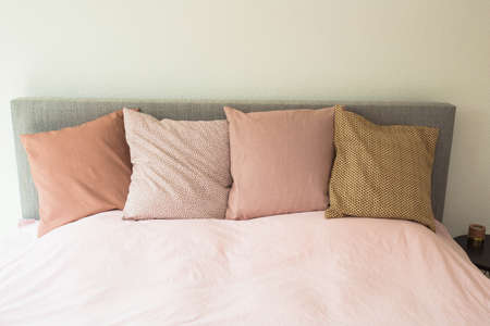 Colorful pillows ,modern bedroom with cozy double bedの写真素材