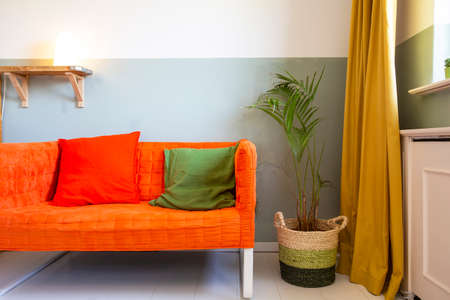 modern room with yellow curtains and orange sofa, colorful Scandinavian design