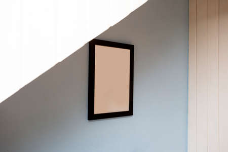 Mock up black frame on blue wall. background texture, space for text