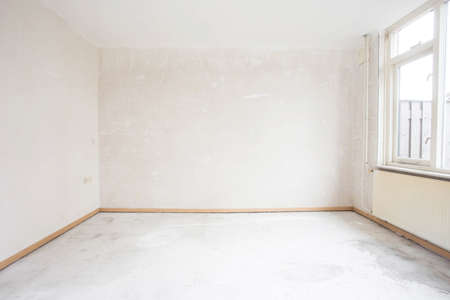 Unfinished building interior, detail of a white room. empty home renovation before