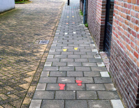 Sidewalk with painted colorful footsteps for children outsideの写真素材